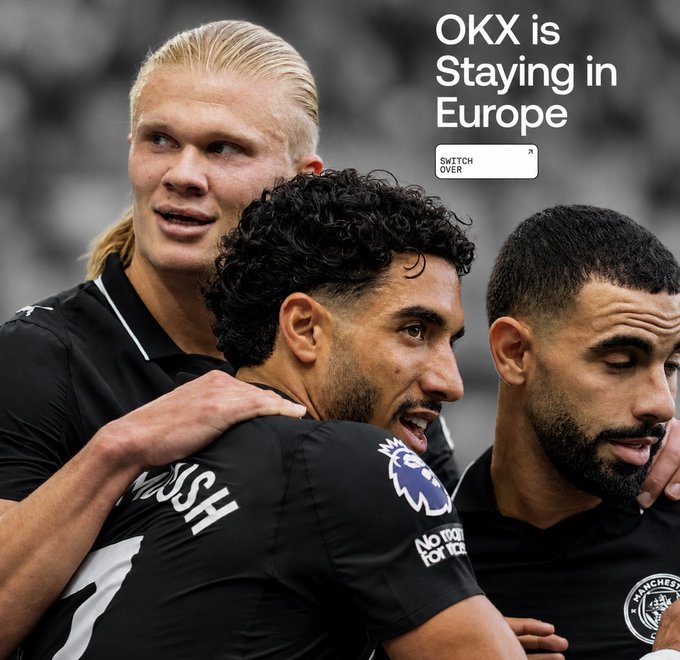 Two Manchester City players, including Erling Haaland, embrace teammates in celebration on the pitch, with text reading "OKX is Staying in Europe" and a "SWITCH OVER" button—aligning with the post promoting OKX's MiCA authorization and partnership with the club to market its all-in-one crypto trading app to millions of European users.