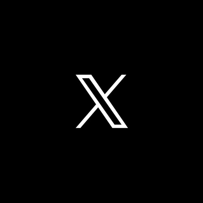 A minimalist black background featuring a white stylized 'X' logo in the center.