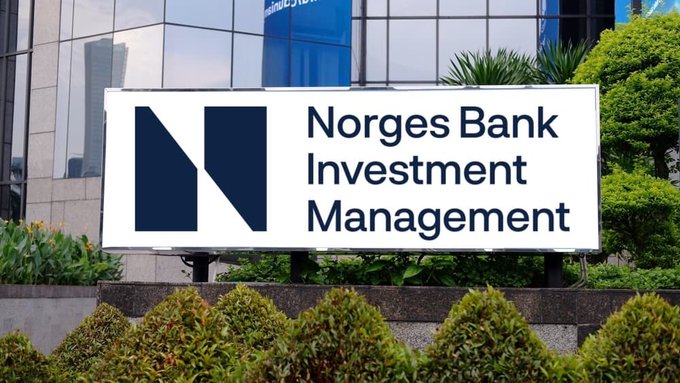 A sign for Norges Bank Investment Management displayed in front of a building with greenery.