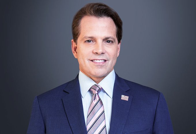 Anthony Scaramucci, founder of SkyBridge Capital, smiles in a professional headshot wearing a navy suit, light blue shirt, and striped pink tie with an American flag lapel pin, accompanying his bullish forecast that Bitcoin could surpass major tech giants like Amazon and Nvidia and exceed $200,000 in value.