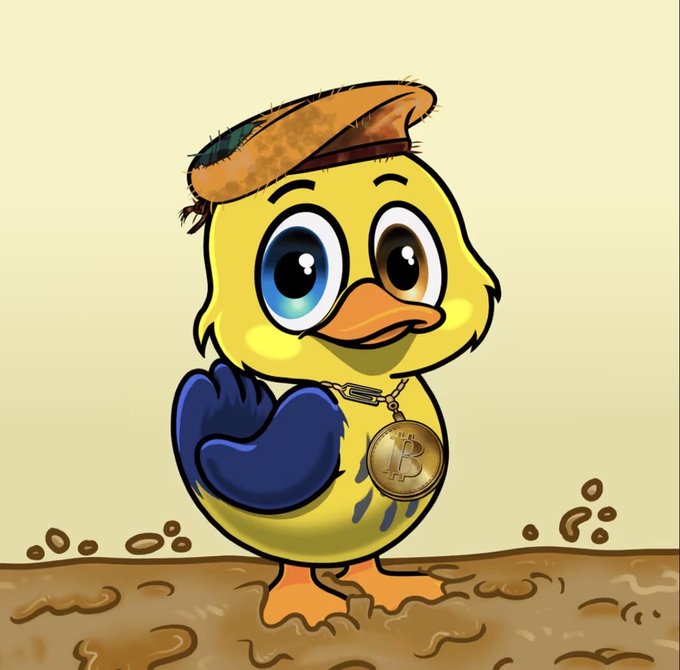 A cartoon yellow duck wearing a beret and a Bitcoin (₿) medallion stands proudly in mud, matching the post's description of a gifted NFT from the Yucky Ducks team featuring "beret, blue wing energy, #Bitcoin chain" vibes.