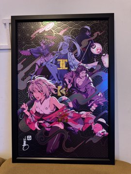 A framed anime poster featuring characters in dynamic poses against a colorful background with Japanese text, including 'R' visible at the bottom.