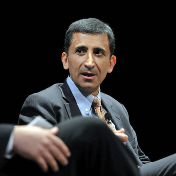 Faryar Shirzad, Coinbase's chief policy officer, is shown speaking at what appears to be a panel discussion, likely discussing the bipartisan CLARITY Act legislation mentioned in the accompanying post.