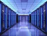 A server room illuminated with blue lighting, rows of data center racks stretching down a corridor, symbolizing the computing infrastructure that powers Ethereum's network and broader crypto ecosystem. The accompanying caption highlights how much of crypto continues to revolve around Ethereum across key sectors like stablecoins, DeFi, and Layer 2s.