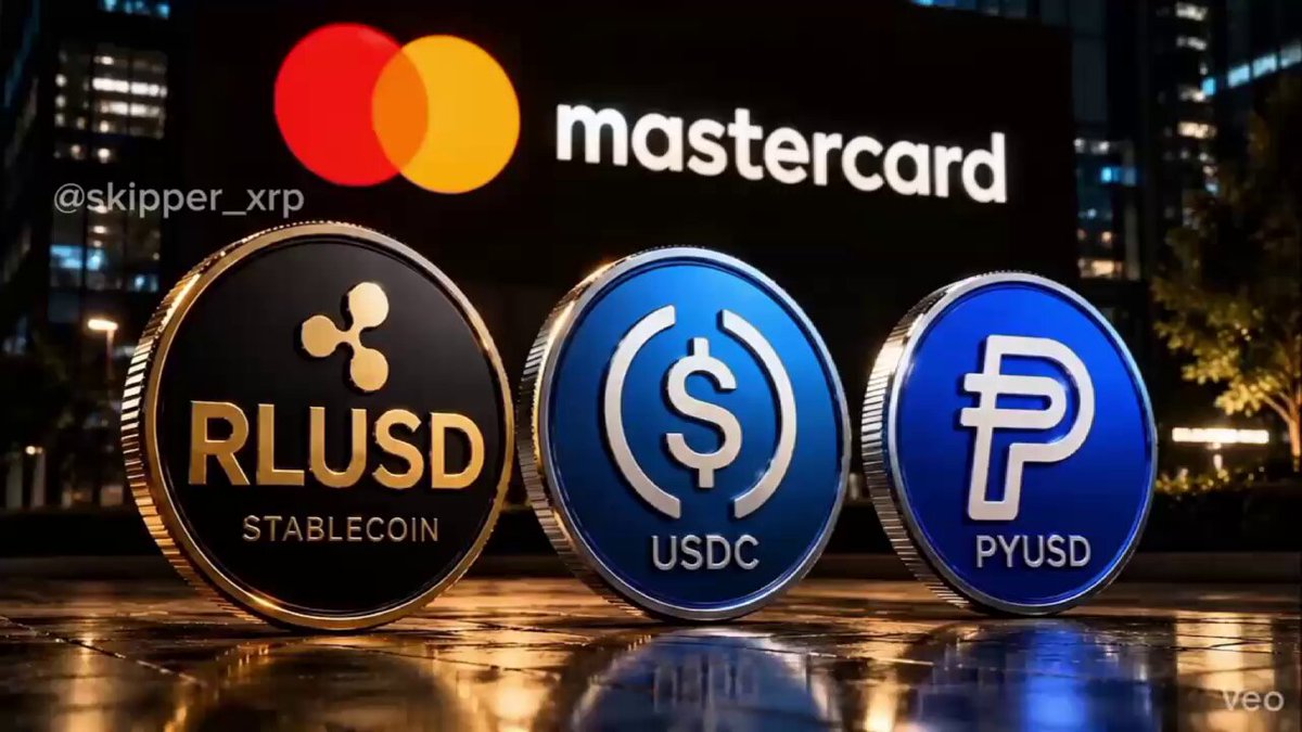 The image features three different cryptocurrencies - Bitcoin (BTC), Ripple (XRP), and USDC (USDC) - displayed against a dark background with a building visible behind them. The text "Mastercard" is also present, suggesting that these coins are related to Mastercard or its services.