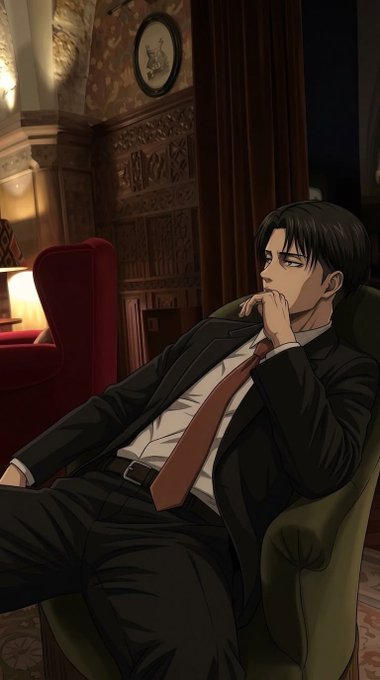 An anime-style illustration shows a serious dark-haired young man in a black suit and red tie sitting in a green armchair, resting his chin thoughtfully on his hand in an ornately decorated room with red curtains and a framed portrait.