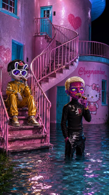 Two stylized figures pose in a flooded pink building adorned with hearts and a Hello Kitty mural, one seated on a spiral staircase wearing gold and white sunglasses with bunny ears, while the other stands in the water blowing a bubblegum bubble. The text "@begonyabnbnb" is visible on the wall, and the post's playful tone of "GM fockers" and "He's a cute Focker" complements the surreal, funhouse-like aesthetic of the scene.