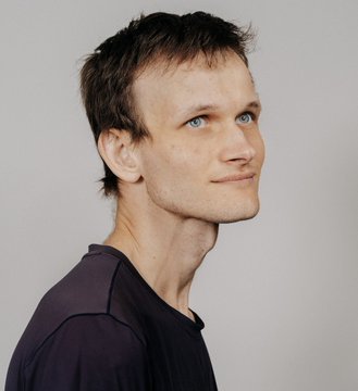 A young man with short dark brown hair, blue eyes, and a slight smile looks toward the camera, wearing a dark gray T-shirt against a plain light gray background, seemingly unrelated to the post about Ethereum's planned quantum-resistant security upgrade targeting 2029.