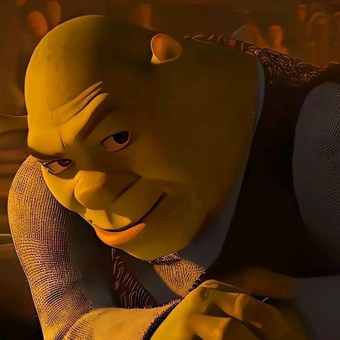 The image features a cartoon character named Emmanuel, who appears to be a man wearing a vest and tie. He has a serious expression as he looks down at something or someone. The caption below the image reads "Emmanuel is watching @wallchain team by the corner of the eye. I am thinking of consistency, patience and discipline we put into the AttentionFi here overnight". This caption suggests that Emmanuel might be observing his favorite cartoon show or character from the @wallchain team, which could be a part of the movie "@wallchain" featuring the character named Emmanuel. The image also includes a reference to the post about consistency, patience, and discipline in the context of the movie's content.