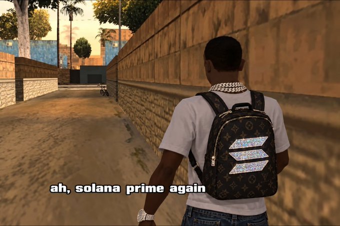 A scene from a video game shows a character from behind wearing a white shirt and a Louis Vuitton-style backpack with a Solana logo, with text reading 'ah, solana prime again'.