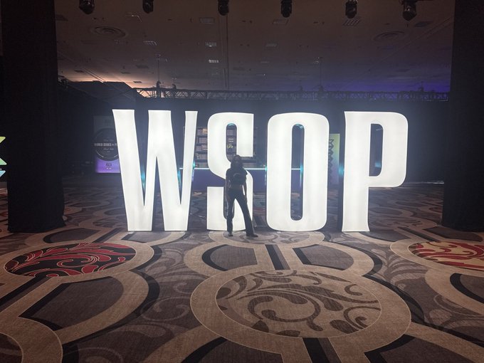 A person poses in front of large illuminated "WSOP" letters at an event, which relates to the post's message about reaching a wider audience ("HIGHER") beyond a single platform, symbolizing the speaker's expanded reach and influence in crypto content across multiple channels.
