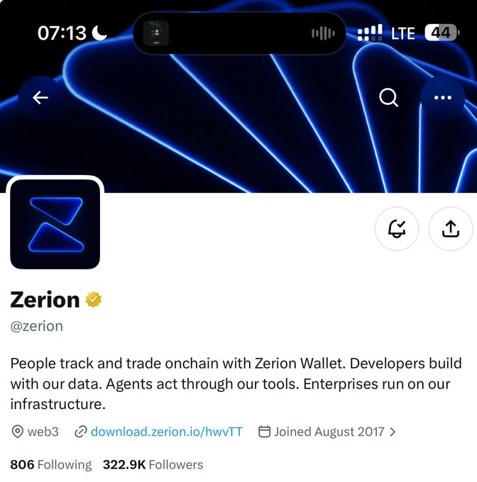 A mobile screenshot of the Zerion Twitter/X profile (@zerion) showing their verified badge, bio about tracking and trading onchain with Zerion Wallet, web3 tag, and 322.9K followers.