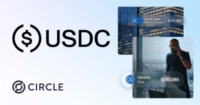 The image features a logo with the words "USDC" written in black letters against a white background. Below this logo, there are two images of buildings - one showing an office building and another depicting a city skyline. The text on the image reads "Just In: Circle launches zero-fee tier for USDC".