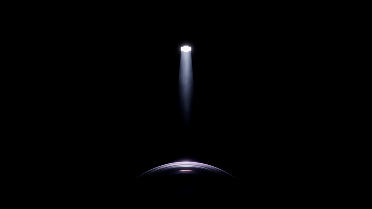 A minimalist image showing a glowing light fixture casting a beam of light down onto the curved top of a dark, dome-shaped object against a black background.