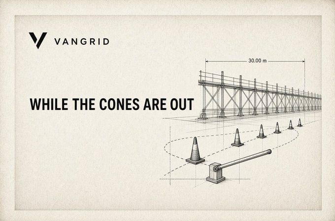 A VANGRID advertisement displays a technical blueprint-style illustration of a construction site barrier with traffic cones and a boom gate, with the slogan 'WHILE THE CONES ARE OUT' and dimensions marked at 30.00 m.