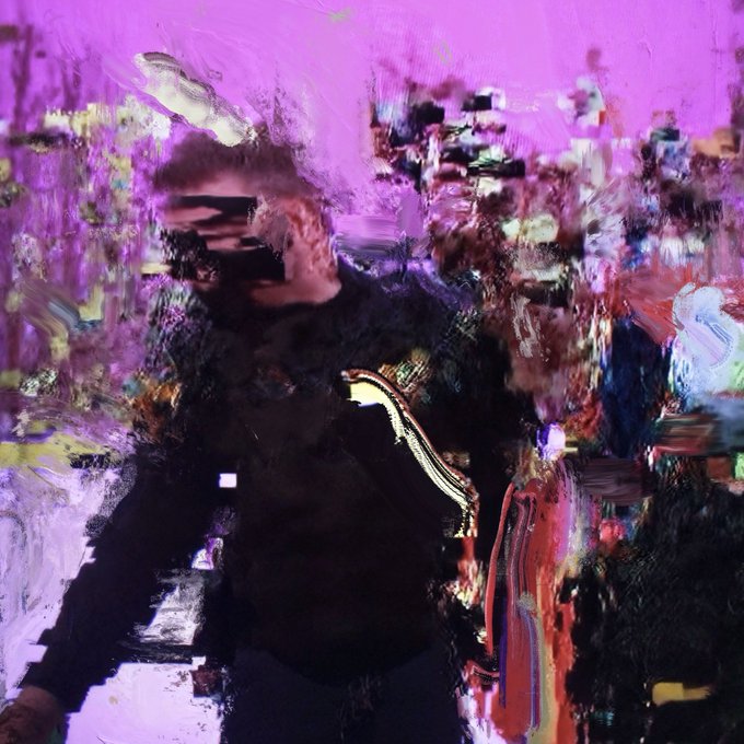 An abstract, glitchy artwork shows a dark figure with obscured features against a chaotic background of magenta, black, and glitch effects.