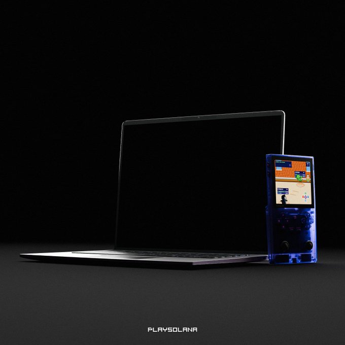 A dark, atmospheric product shot features a sleek laptop with a blank screen alongside a translucent blue handheld gaming device displaying what appears to be Pokémon-style gameplay. The text "PLAYSOLANA" appears at the bottom, tying into the "Soon on a PC near you" caption by teasing the expansion of this Solana-based gaming ecosystem to desktop platforms.