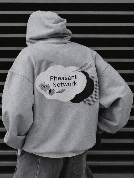 A black-and-white photo of a person wearing a gray hoodie with 'Pheasant Network' printed on the back alongside a retro TV and satellite dish graphic.