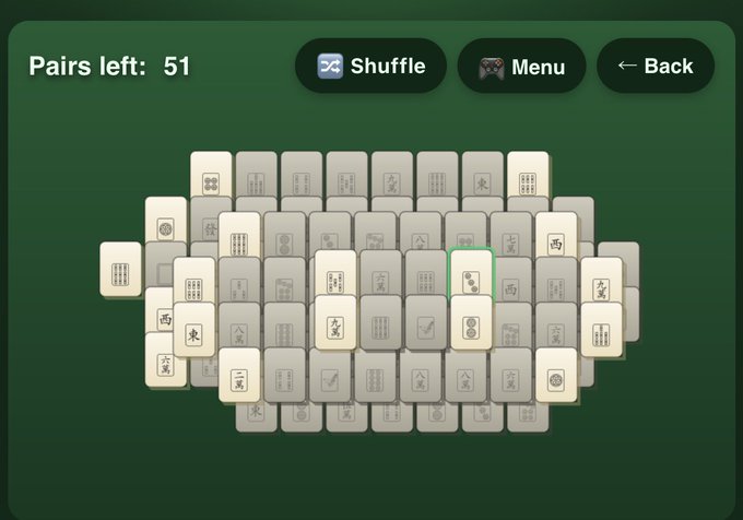 A digital Mahjong matching game displays 51 pairs remaining on a green background with various tile symbols.