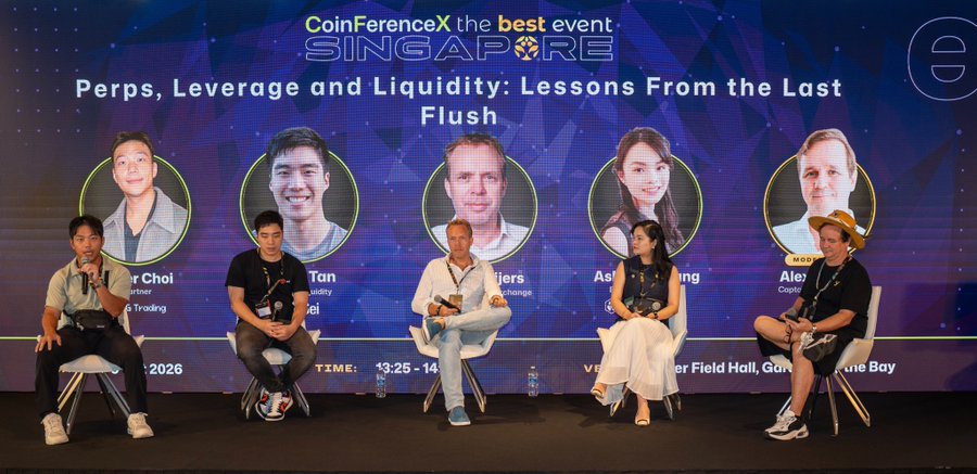 Five panelists sit on stage at CoinFerenceX Singapore discussing "Perps, Leverage and Liquidity: Lessons From the Last Flush," with the backdrop displaying speaker headshots and names including Peter Choi, Julian Tan, Strijers, Ashley, and Alex, aligning with the Day 2 panel featuring representatives from Sei Network, JPEG Trading, and other crypto firms.