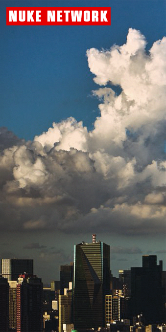 A cityscape of skyscrapers beneath dramatic cumulus clouds, with a red banner reading 'NUKE NETWORK' at the top.