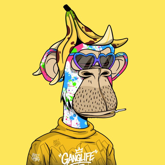 An NFT-style cartoon illustration of a monkey wearing a banana peel hat, heart-shaped sunglasses, and a yellow 'GANGLIFE' sweatshirt against a yellow background.