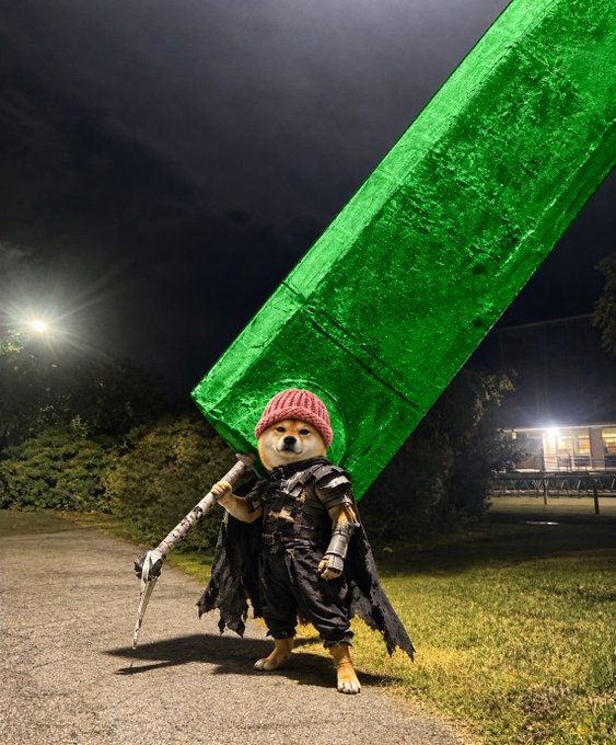 A Shiba Inu dog dressed in a fantasy adventurer costume, complete with a red knit hat, dark cape, and a gigantic emerald-green sword, stands heroically on a paved path at night. The whimsical scene ties into the post's "$WIF" reference—the dogwifhat meme coin—with "UPTOBER" suggesting bullish momentum for both $WIF and $BTH.