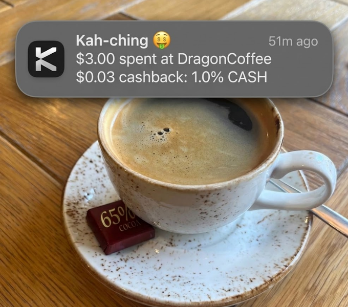 The image shows a cup of coffee sitting on top of a white saucer, placed on a wooden table. The text message includes an emojis and a link to a website for Dragon Coffee. The message also mentions that the person who sent the message is willing to pay for the coffee with their credit card or another form of payment.