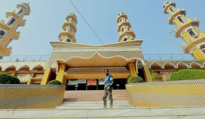 A man in a tie-dye shirt stands on the steps of an ornate mosque with golden minarets and yellow-tiled walls under a clear blue sky.

The image's grand, almost dreamlike architecture serves as a whimsical backdrop to the poster's hopeful longing to finally witness Bitcoin hitting $200K, with the towering spires mirroring the towering price target they've been waiting to see.