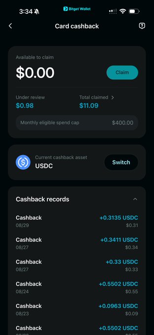 A screenshot of the Bitget Wallet app showing a 'Card cashback' page with an 'Available to claim' balance of $0.00, a current cashback asset of USDC, and a list of recent cashback records in USDC.