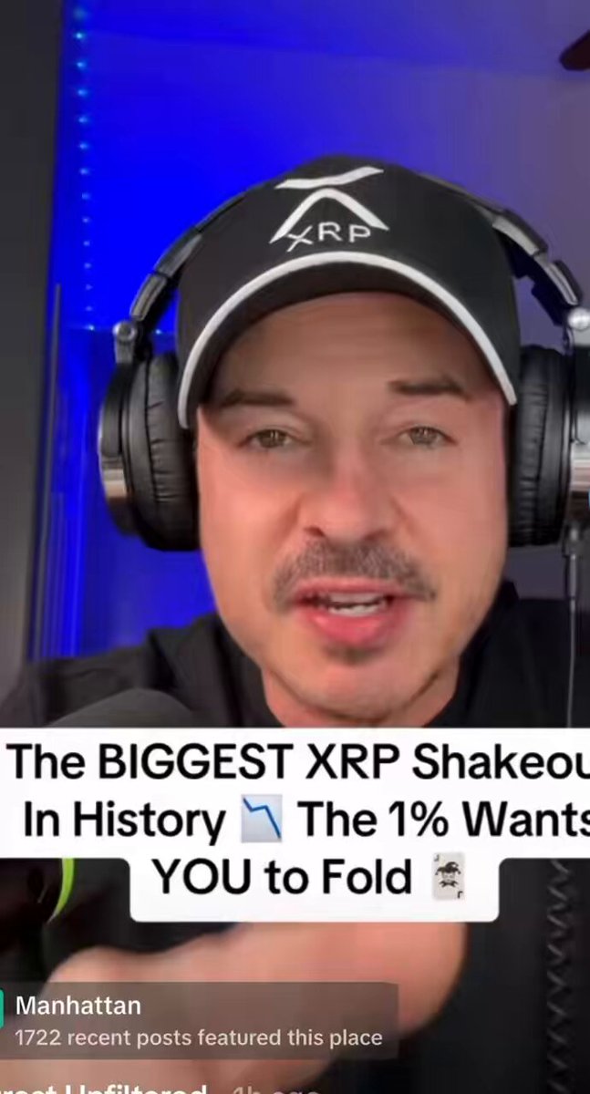 The image features a man wearing headphones that are black and white with an XRP symbol, likely representing Bitcoin. The man appears to be excitedly talking about a new shakeout strategy related to cryptocurrency trading or investing. Additionally, there is another text present in the image, but it is not clear what information it conveys. The focus of this content is the man wearing the black and white headphones while discussing cryptocurrency trends and strategies with his followers on social media platforms.