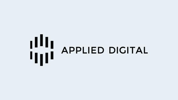 The image shows the Applied Digital logo, featuring a geometric icon of vertical bars alongside the company name "APPLIED DIGITAL" in dark text on a light blue background, corresponding to the $APLD ticker referenced in the post about the company's earnings and stock performance.