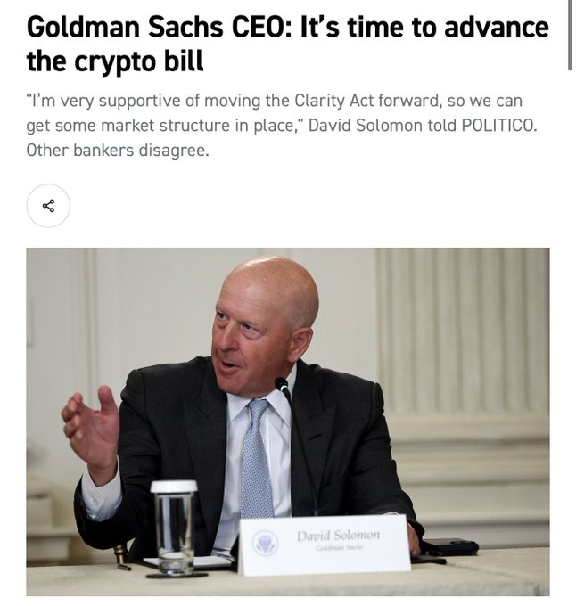 A news article headlines "Goldman Sachs CEO: It's time to advance the crypto bill," featuring Goldman Sachs CEO David Solomon speaking at a podium with his name placard visible. The article quotes Solomon expressing support for moving the Clarity Act forward, aligning with the post's announcement about the Crypto Clarity Act.