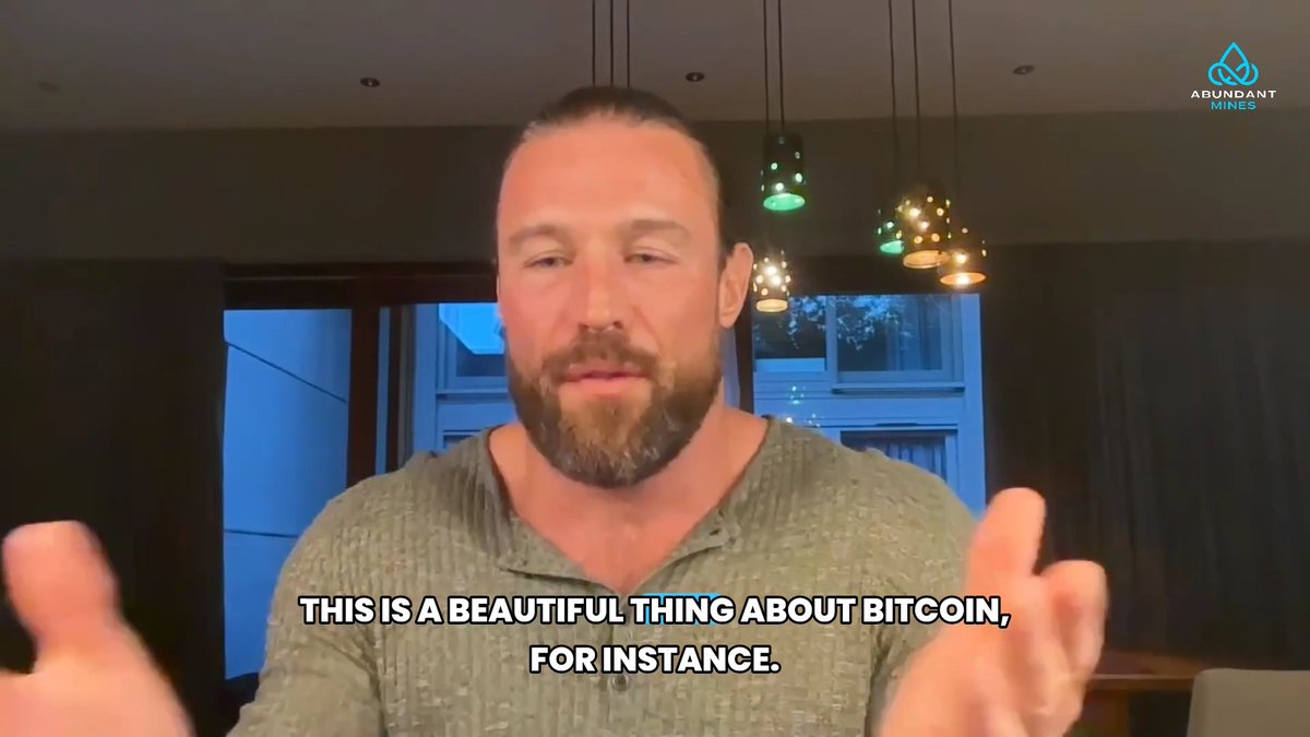 A bearded man in a green henley shirt speaks to the camera, with subtitles reading 'THIS IS A BEAUTIFUL THING ABOUT BITCOIN, FOR INSTANCE.' and an 'ABUNDANT MINES' logo in the corner.