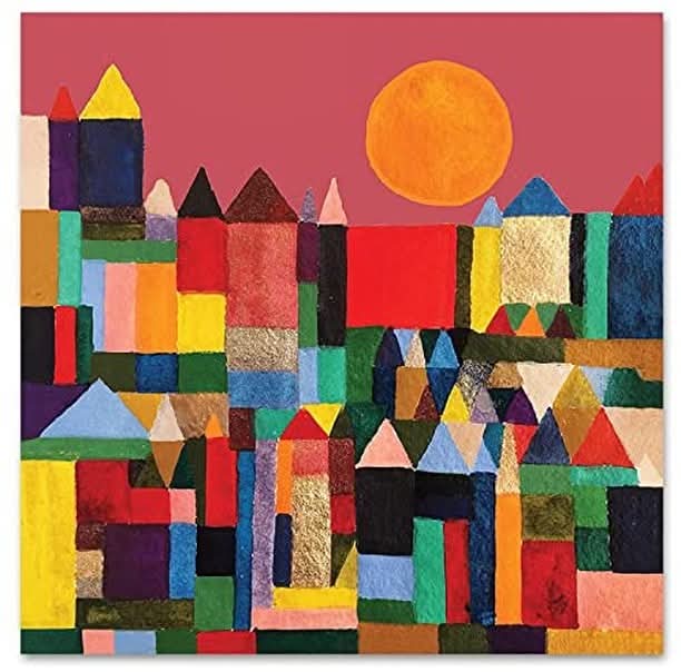 A colorful abstract painting featuring geometric shapes resembling a cityscape with colorful houses and pointed roofs beneath a bright orange sun against a red sky.