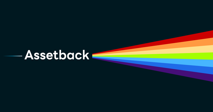 A dark banner features the white "Assetback" logo on the left, from which a vibrant, multicolored rainbow spectrum extends outward to the right. The colorful, expanding rays visually reinforce the brand's promise of "Redefining cash back" by symbolizing a fresh, dynamic take on traditional rewards.