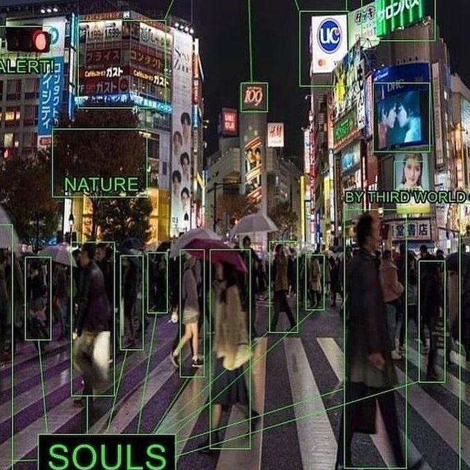 A nighttime view of a busy Japanese crosswalk, likely Shibuya, with crowds of pedestrians crossing beneath illuminated signs including "UC" and "H&M," overlaid with green bounding boxes and text labels such as "ALERT," "NATURE," "BY THIRD WORLD," and "SOULS."