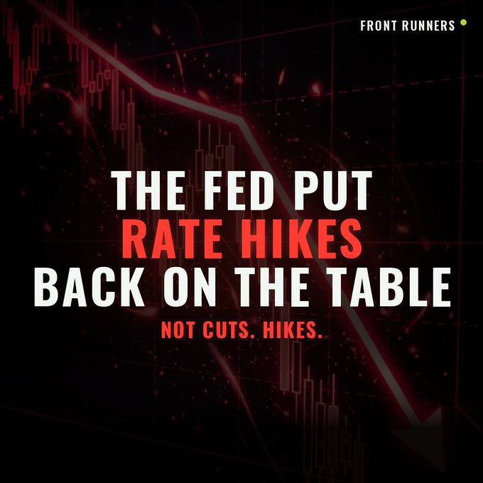 A dark financial graphic from "FRONT RUNNERS" featuring a downward-trending red candlestick chart and arrow, overlaid with bold text reading "THE FED PUT RATE HIKES BACK ON THE TABLE — NOT CUTS. HIKES." The bearish imagery visually reinforces the post's message that Fed minutes signal renewed inflation concerns from AI demand, tariffs, and war risk, keeping rate hikes on the table and pulling money out of markets and crypto.