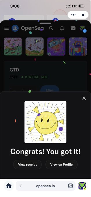 A screenshot of the OpenSea app on a mobile browser (opensea.io) showing a "Congrats! You got it!" mint confirmation popup featuring a child-like drawing of a smiling sun, with a GTD collection marked "MINTING NOW" visible behind the modal.