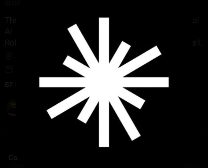 A white asterisk or starburst loading icon centered on a black background.