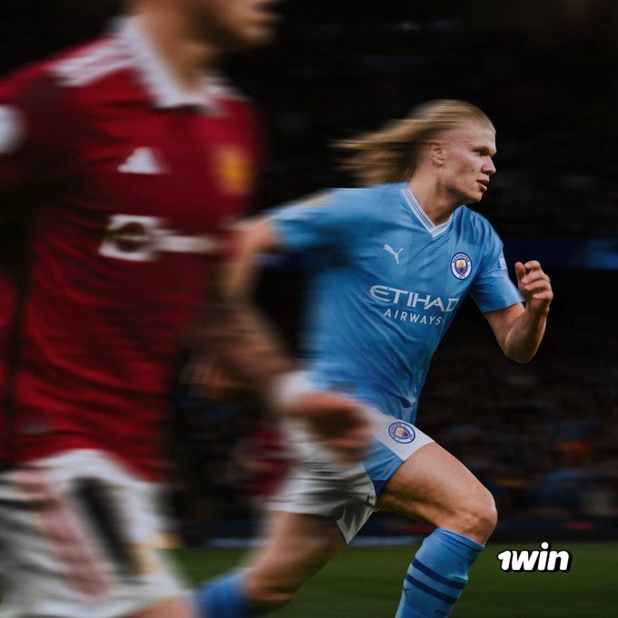 A Manchester City soccer player in a light blue 'ETIHAD AIRWAYS' jersey runs on the field alongside an out-of-focus opponent in a red kit, with '1win' text in the corner.