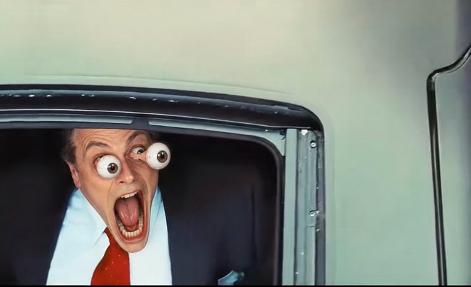A Mr. Bean scene showing him with comically bulging, protruding eyeballs and his mouth wide open in shock, leaning out of a vehicle window.