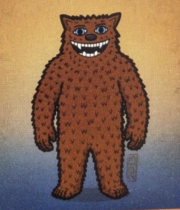 A whimsical, cartoonish brown furry creature with a wide toothy grin and big blue eyes stands against a sunset-to-ocean gradient background, evoking the playful spirit of the "$FUZZY #FREEFUZZY" meme token by personifying the fuzzy character mascot behind the project.
