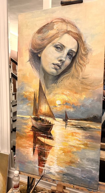 An oil painting of a woman's face blended with a seascape featuring sailboats and a sunset on an easel.