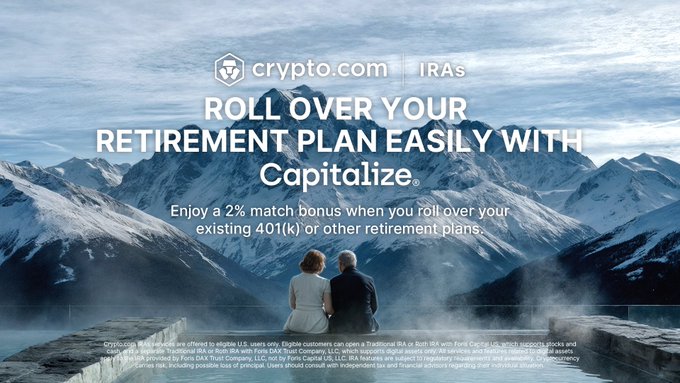 The image shows a couple standing together on a mountain with snow-capped peaks. The text in the image reads "With our new Capitalize integration, moving your retirement funds is fast, secure, and entirely digital. Rollover in a few clicks Live progress updates Explore how to get an exclusive 2% match on 401(k) and IRA rollovers now crypto". This indicates that this advertisement may be promoting a new feature or integration related to the process of rolling over retirement funds using cryptocurrency. The text " crypto.com iras" suggests that this is a promotional material for a financial institution, Crypto.com, which is associated with IRA plans.