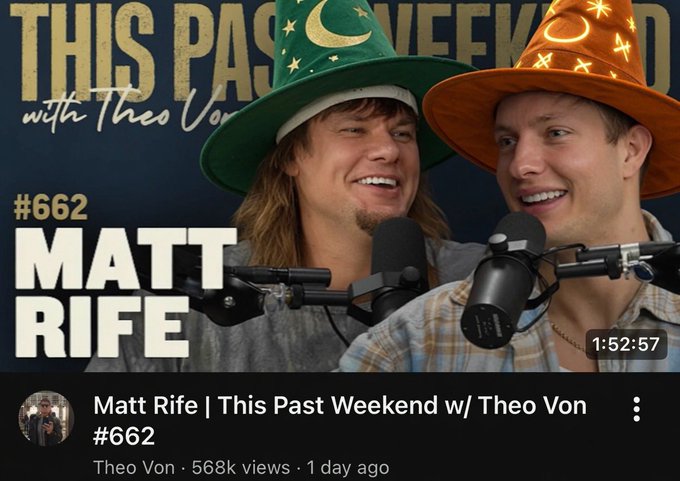 In this image, there are two men wearing hats with stars on them, standing next to each other. They appear to be smiling for a photo opportunity or participating in an event related to their podcast. The background of the image features text that reads "This Pass Weekend" and "Matt Rife @Theo Von". This suggests that they might be discussing a topic related to their podcast or sharing some personal experiences with their audience.