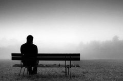 A silhouetted figure sits alone on a foggy bench, their back to the camera, facing a hazy horizon. The image's bleak, isolated atmosphere contrasts sharply with the post's optimistic declaration about a "bright" future.