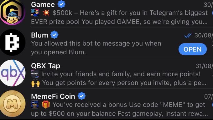 A screenshot of Telegram bot messages showing notifications from Gameee ($500k prize pool notification), Blum, QBX Tap (referral program), and MemeFi Coin (bonus offer with code MEME).