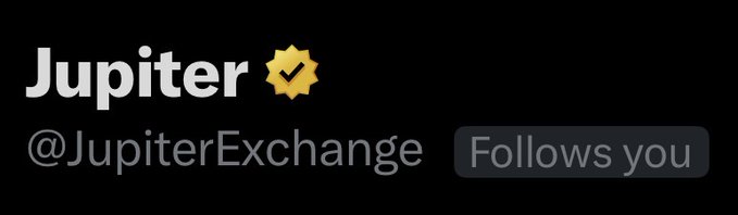 A profile header for Jupiter (@JupiterExchange) displays the account name in white text alongside a yellow verified checkmark badge, with a "Follows you" indicator on the right. The accompanying post "Who still needs this?" appears to humorously reference the verified status, suggesting that verification badges may no longer be necessary or meaningful in the crypto space.