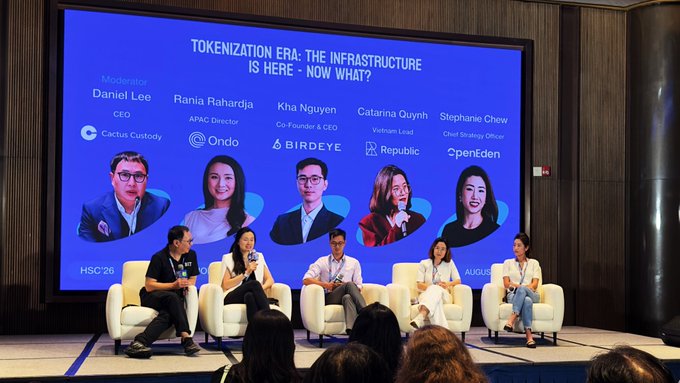 A panel discussion titled "Tokenization Era: The Infrastructure Is Here - Now What?" at HISC'26, moderated by Daniel Lee (CEO, Cactus Custody) with speakers Rania Rahardja (APAC Director, Ondo), Kha Nguyen (Co-Founder & CEO, Birdeye), Catarina Quynh (Vietnam Lead, Republic), and Stephanie Chew (Chief Strategy Officer, PenDen), seated on stage as the discussion explores what assets, buyers, and distribution challenges will drive demand for tokenization beyond its established infrastructure.